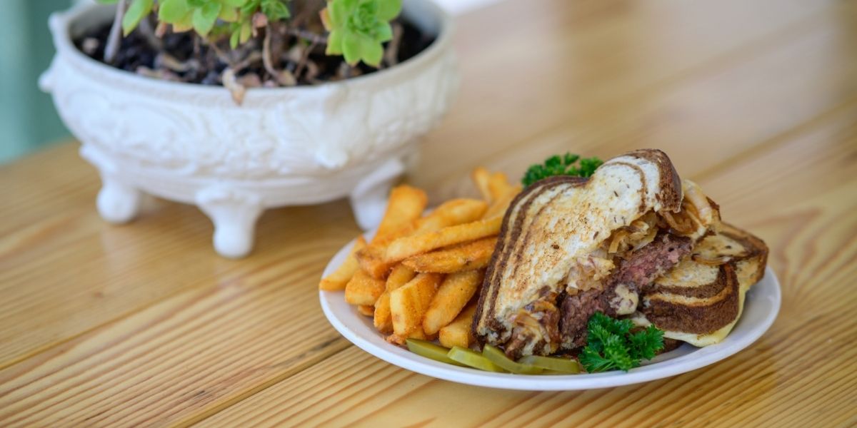 Marbled rye bread is what makes this patty melt filled with grilled onions and melted Swiss cheese standout.