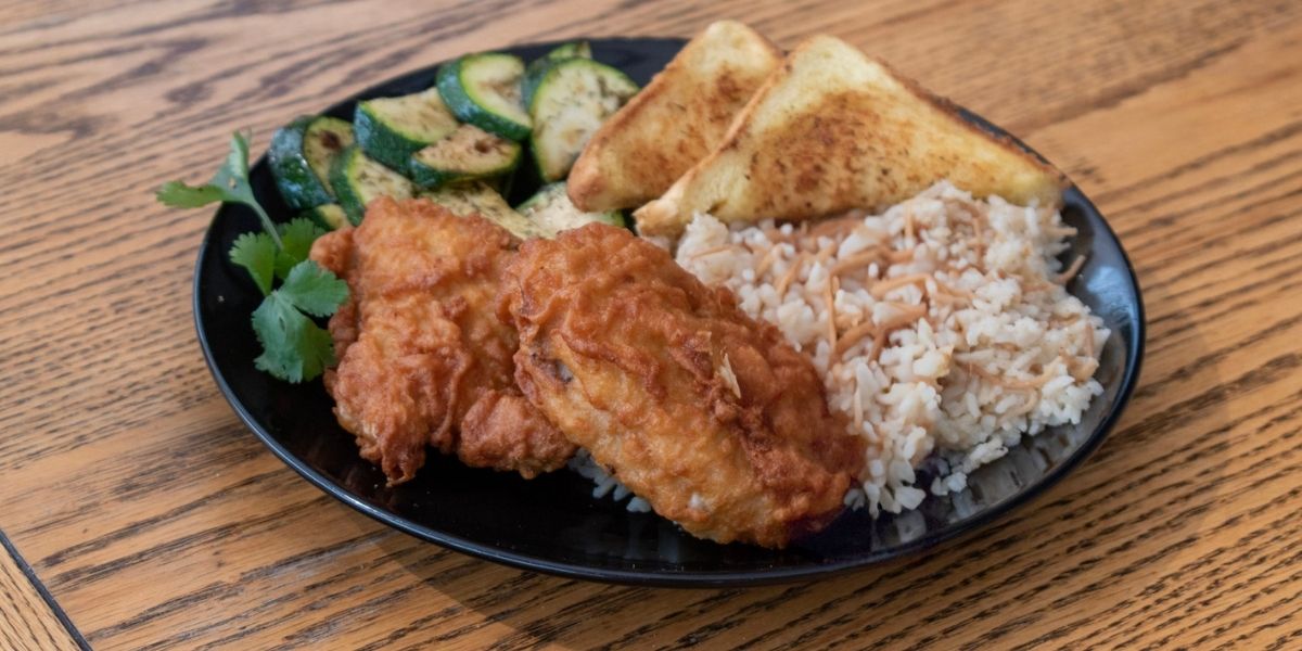 Nana's fried chicken with rice pilaf and Chef's veggie medley is a hearty meal to warm the soul.