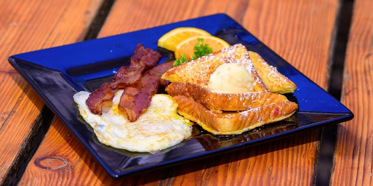 Thick Texas Toast makes for a hearty French toast smothered in butter and maple syrup.