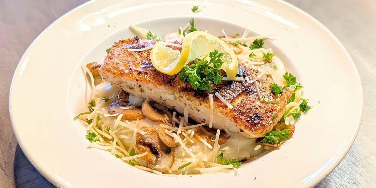 Our forest and sea pasta comes with salmon and mushrooms over an alfredo sauce.